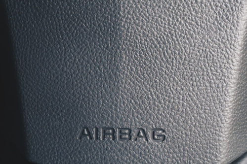 Clos up airbag sign on a cars dashboard
